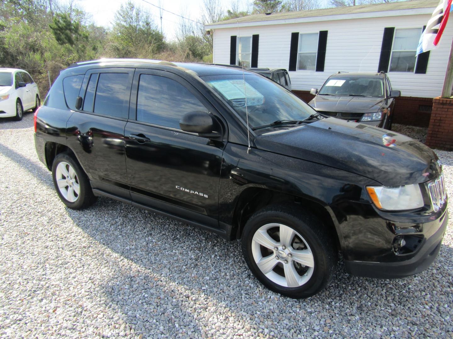 2012 Black /Gray Jeep Compass Sport FWD (1C4NJCBA7CD) with an 2.0L L4 DOHC 16V engine, Automatic transmission, located at 15016 S Hwy 231, Midland City, AL, 36350, (334) 983-3001, 31.306210, -85.495277 - Photo#0